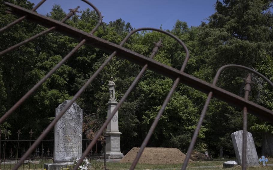 The Confederate statue recently relocated from the Greensville County Courthouse rests in its new location in the Emporia Cemetery in Virginia. 