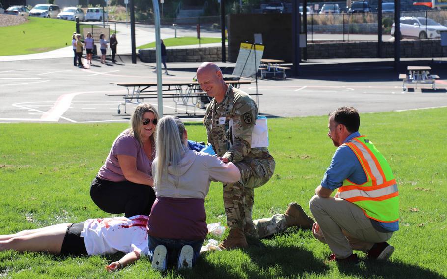 Dr. Quinton Hatch, general surgery program director at Madigan Army Medical Center at Joint Base Lewis-McChord, Wash., leads a training exercise on traumatic injury care to health professionals with Peninsula School District. The course is part of a Defense Department-supported program called Stop the Bleed, which teaches civilians lessons on trauma care the military has developed for troops in combat zones.