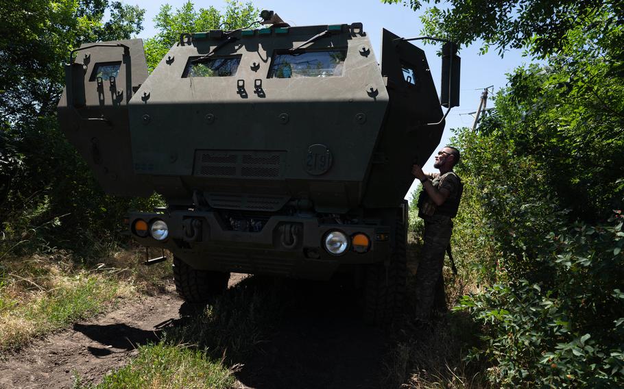 A Ukrainian serviceman opens the door to a HIMARS vehicle in eastern Ukraine on July 1.