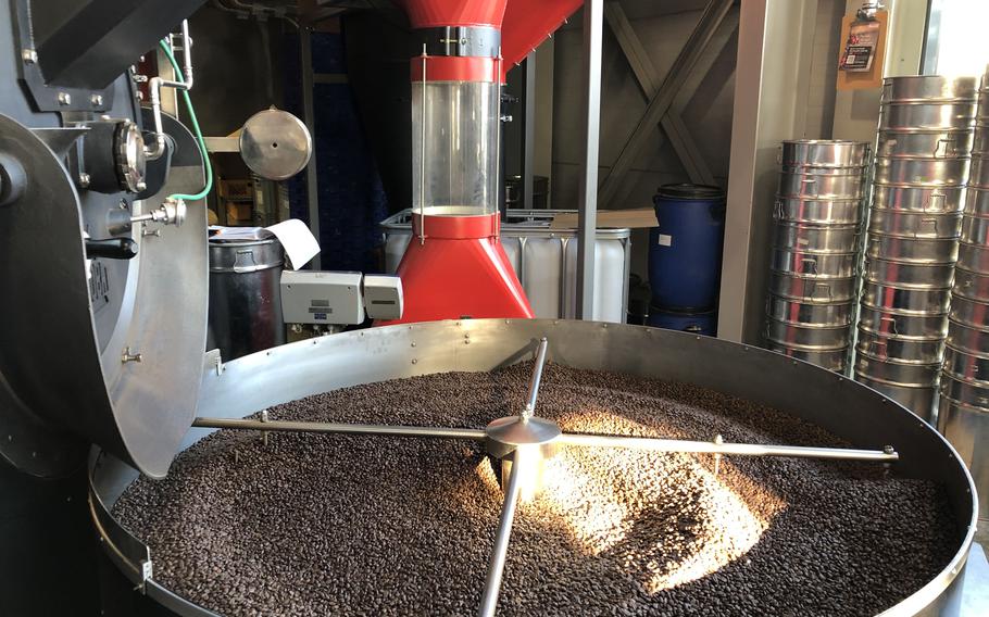 Coffee beans are roasted in a large vat inside Blank Roast coffee shop in Neustadt, Germany.