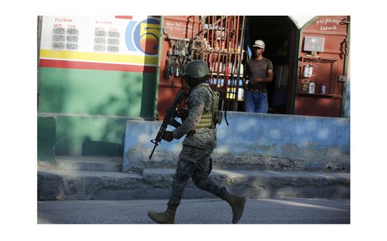 A soldier patrols the outskirts of the international airport in Port-au-Prince, Haiti, Monday, March 4, 2024. Gang members exchanged gunfire with police and soldiers around the airport in the latest of a series of attacks on government sites that includes a mass escape from the country's two biggest prisons. 