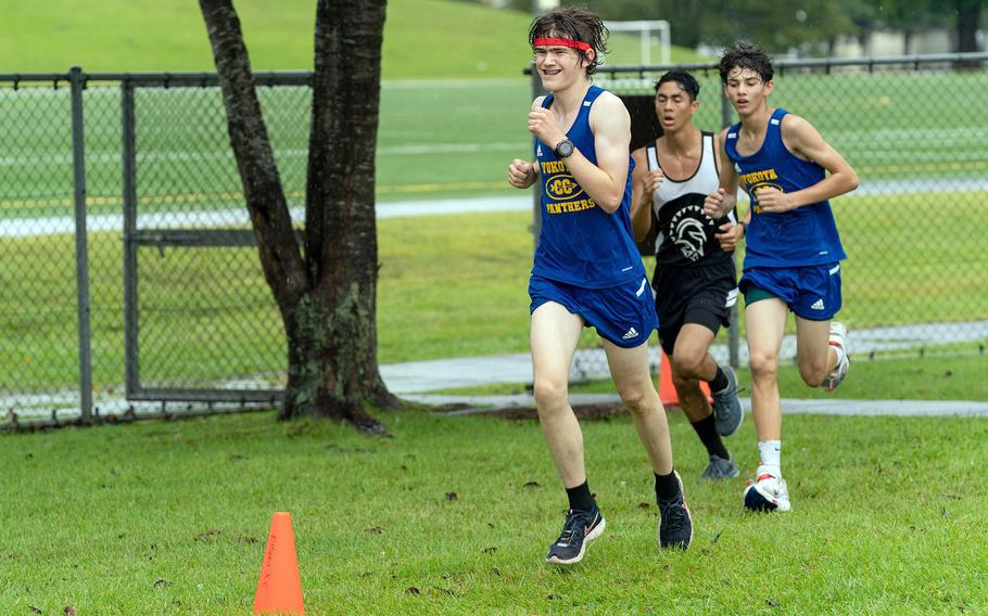 Yokota's Atticus Gray and Davi ShimaEnesDe and Zama's Gabriel Escalera navigate a turn during Saturday's DODEA-Japan cross-country race. ShimaEnesDe took second place, Gray third and Escalera fourth.