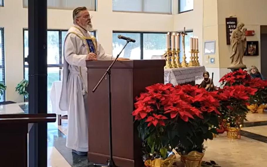 In a screenshot from the Naval Air Station Sigonella, Italy chapel's Facebook page, the Rev. Frank Watts celebrates the New Year's Day mass, Jan. 1, 2023. Watts has filed IG complaints alleging fraud and reprisal by the base’s lead chaplain, who the priest says targeted him over the last year leading to the base’s decision not to renew his contract. 