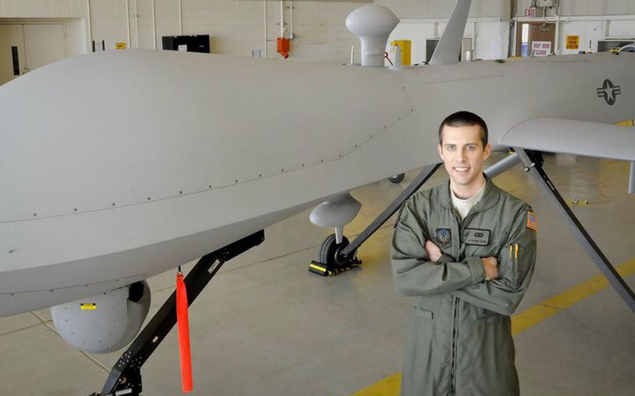 Capt. Jon Young stands in front of a Predator drone at Cannon Air Force Base, N.M., in 2009. Young served as an intelligence officer and senior mission intelligence coordinator in the 3d Special Operations Squadron. He was inspired to join the military after the 9/11 terrorist attacks.