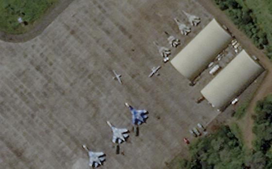This satellite image provided by Planet Labs PBC shows the airport in Bahir Dar, the capital city of the Amhara Region of northern Ethiopia on Friday, Oct. 21, 2022. According to image analysis by armaments expert Wim Zwijnenburg of Dutch peace organization PAX, and and Justine Gadon of Stockholm International Peace Research Institute (SIPRI), the wingspan length, shape and other identifying details of the two smaller aircraft visible in the image are consistent with those of the Turkish-made Bayraktar TB2 drone. (Planet Labs PBC via AP)