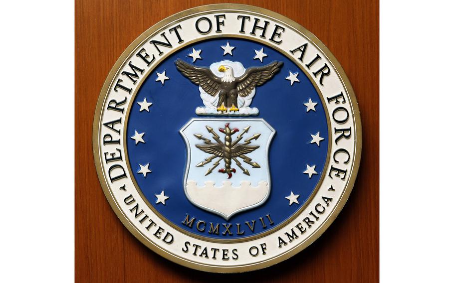 Air Force seal on a wooden door.