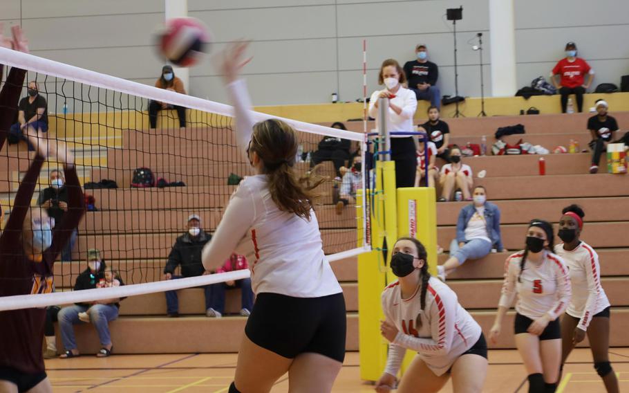 Kaiserslautern’s Isabella Ross, left, slams a ball during a volleyball match against Vilseck High School at Vilseck, Germany, Saturday, Oct. 9, 2021.