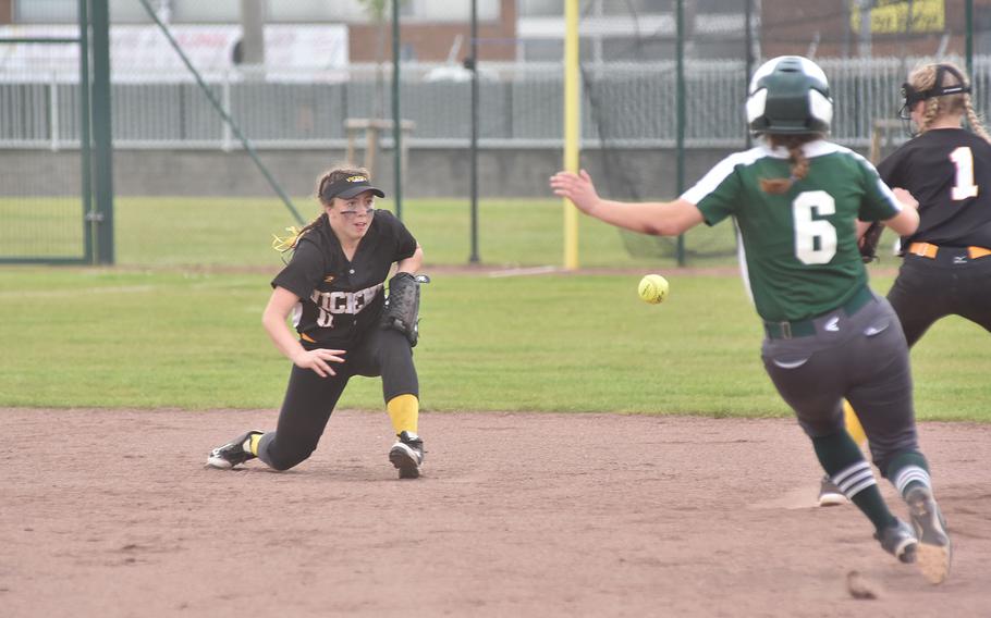 Vicenza shortstop Hannah Findlay tosses to teammate Grace Harkison in time to force Naples' Lucy Black at second base in the DODEA-Europe Division II/III softball championship game Saturday, May 20, 2023, at Kaiserslautern, Germany.