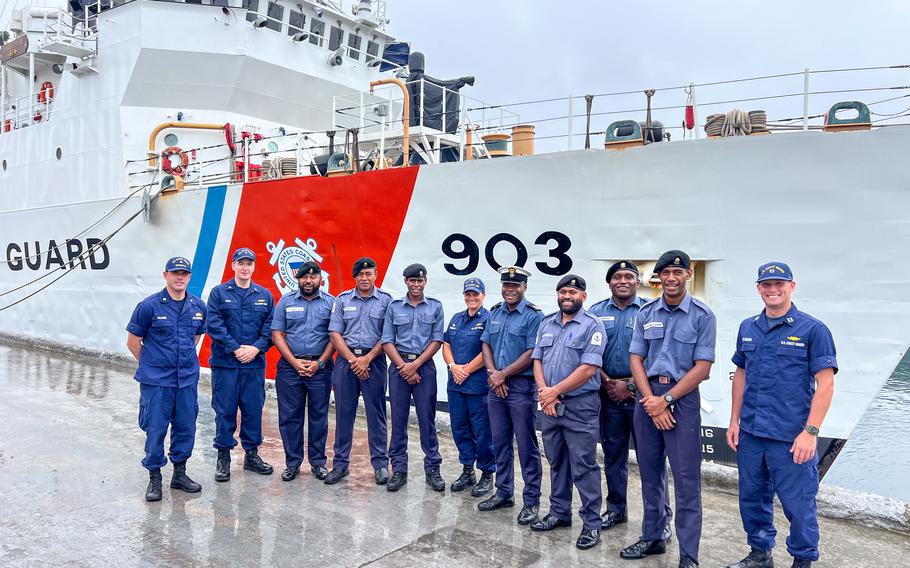 U.S. Coast Guard and Fiji Navy personnel stand in front of the U.S. Coast Guard Cutter Harriet Lane while moored in Suva, Fiji, Feb. 19, 2024. 