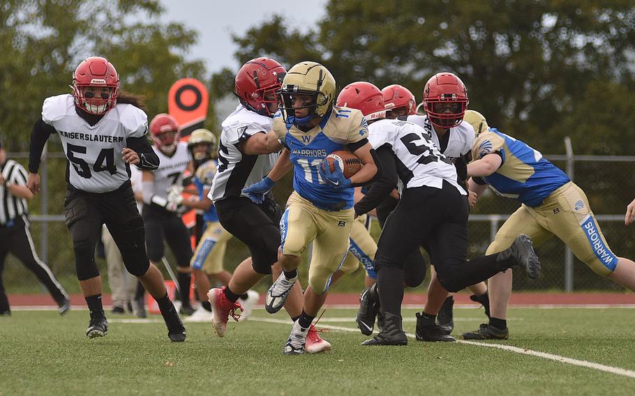 Warrior running back Munro Davis looks to bust a run to the outside during a Sept. 22, 2023, game at Wiesbaden High School in Wiesbaden, Germany.