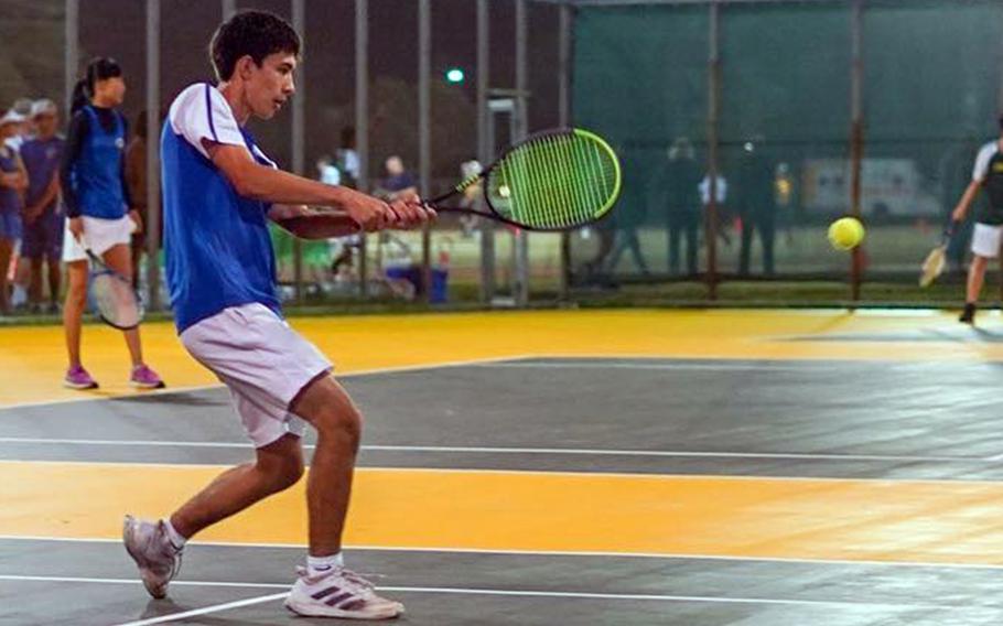 Yokota's Kai Patton hits a two-hand backhand during his 8-5 loss to Rim Gong of Robert D. Edgren during Friday's DODEA-Japan singles tennis matches at Misawa Air Base.