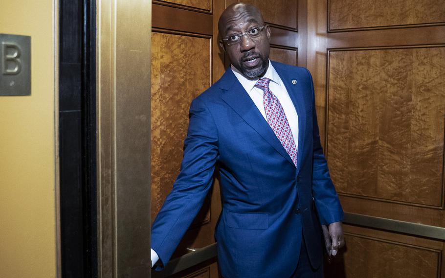 Sen. Raphael G. Warnock, D-Ga., speaking to reporters on Capitol Hill on May 26, is seeking reelection this November against GOP candidate Herschel Walker.