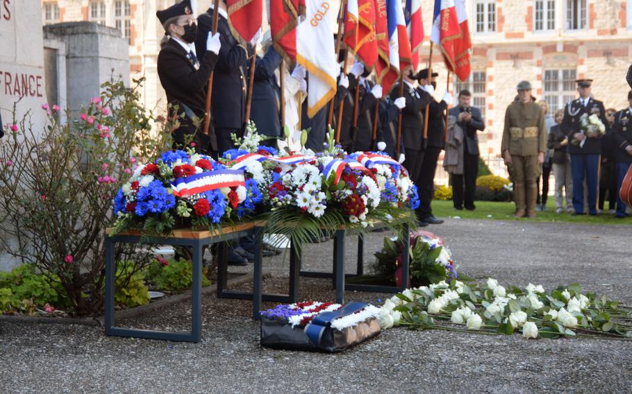 Wreaths and flowers left by French and American guests are placed at  a monument to World War I service members who died for France at the Cathedral Saint Etienne in Chalons-de-Champagne, France, Oct. 24, 2021. The ceremony followed events honoring the selection 100 years ago of the U.S. Unknown Soldier in the city.   