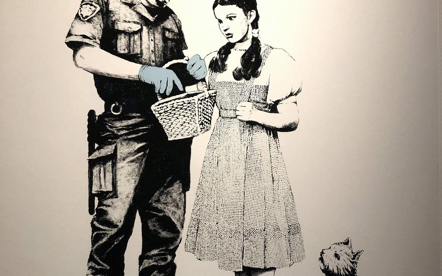 "Stop and Search" by street artist Banksy is on exhibit at With Harajuku in Tokyo until March 2022.