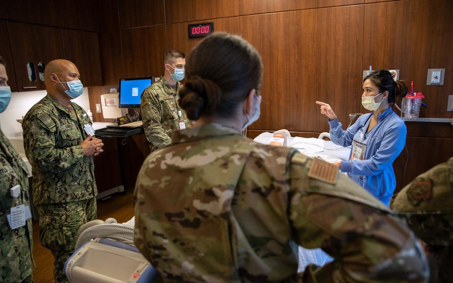 In this photo from April 24, 2020, U.S. military medical personnel, including U.S. Army reserve and Connecticut National Guard, train with Stamford Hospital medical staff in Stamford, Connecticut. Now, nearly two years later, many hospitals across the United States again are being assisted by troops to deal with the heavy patient load.