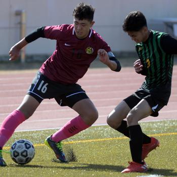 Matthew C. Perry's Ren Spinosi turns into Robert D. Edgren's Patrich Lorenzo with the ball during Friday's Samurai 3-0 Perry Cup win over the Eagles. 