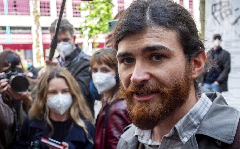 Franco A. walks to a court for the start of a trial on charges of preparing a serious act of violence endangering the state in Frankfurt, Germany, May 20, 2021. The court sentenced the Bundeswehr officer to five and a half years in prison for, among other things, preparing a serious crime endangering the state.