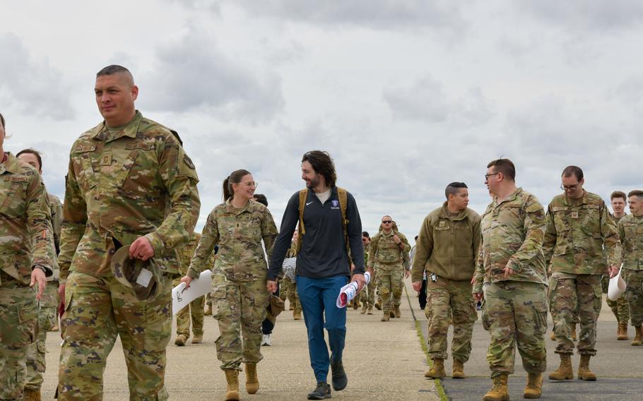 Airmen walk together in a group