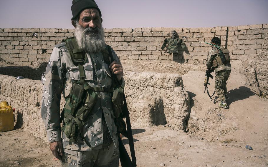 Afghan army soldiers occupy a position on the front line that is exposed to Taliban sniper fire at the Nazar outpost near Lashkar Gah on May 25, 2021.