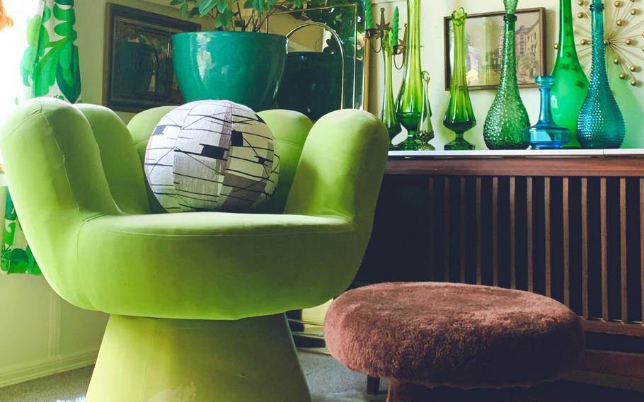 This funky, hand-shaped chair was one of the first pieces that Chanel Boeve-Roth picked up for her green sitting room. The combination of the chair and some emerald hanging lights sparked the vision for the entire room. 