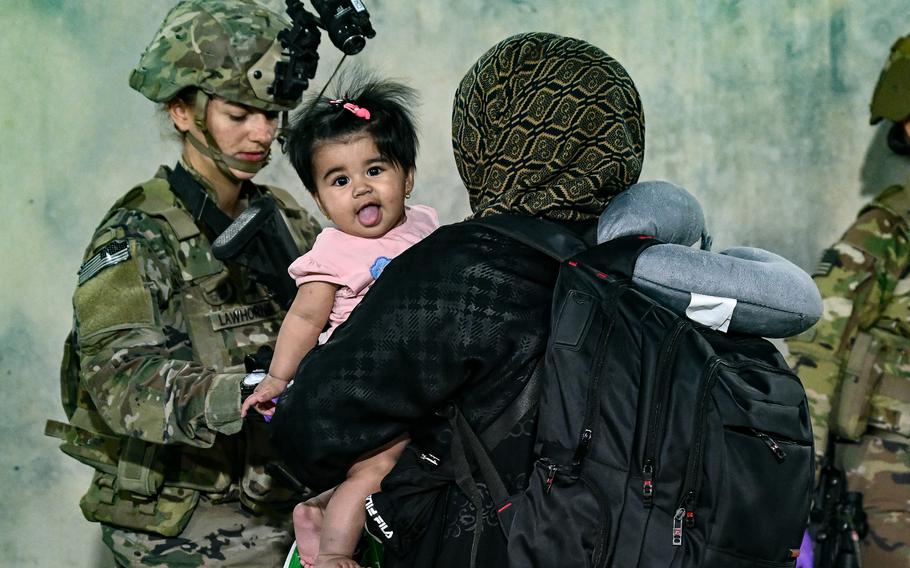 Paratroopers assigned to the 1st Brigade Combat Team, 82nd Airborne Division, based out of Fort Bragg, N.C., facilitate the safe evacuation of U.S. citizens, Special Immigrant Visa applicants, and other at-risk Afghans out of Afghanistan from Hamid Karzai International Airport in Kabul on Aug 22, 2021. 