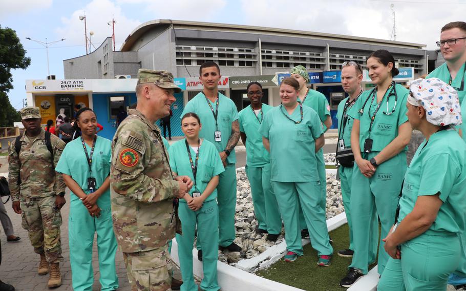 Maj. Gen. Todd Wasmund, commander of the Southern European Task Force, Africa, congratulates a team of Army and Air Force medical personnel June 14, 2023, during an exercise in Accra, Ghana.