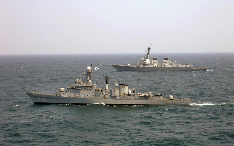 The South Korean Ulsan-class frigate ROKS Seoul, foreground, sails alongside the guided-missile destroyer USS McCampbell in 2011.