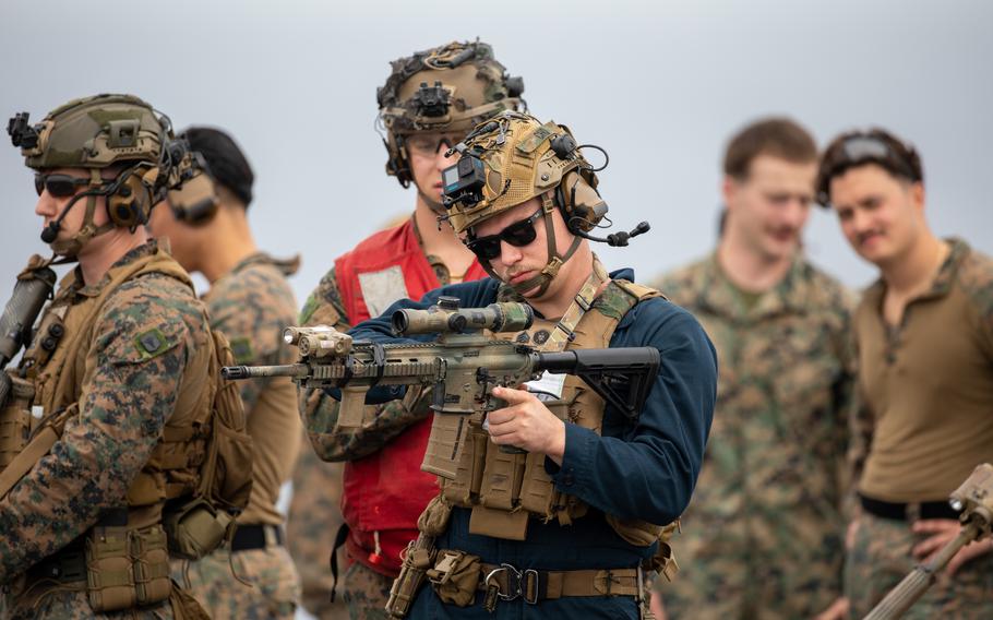 Marines with the 24th Marine Expeditionary Unit and sailors assigned to the amphibious assault ship USS Wasp conduct weapons drills on the flight deck.