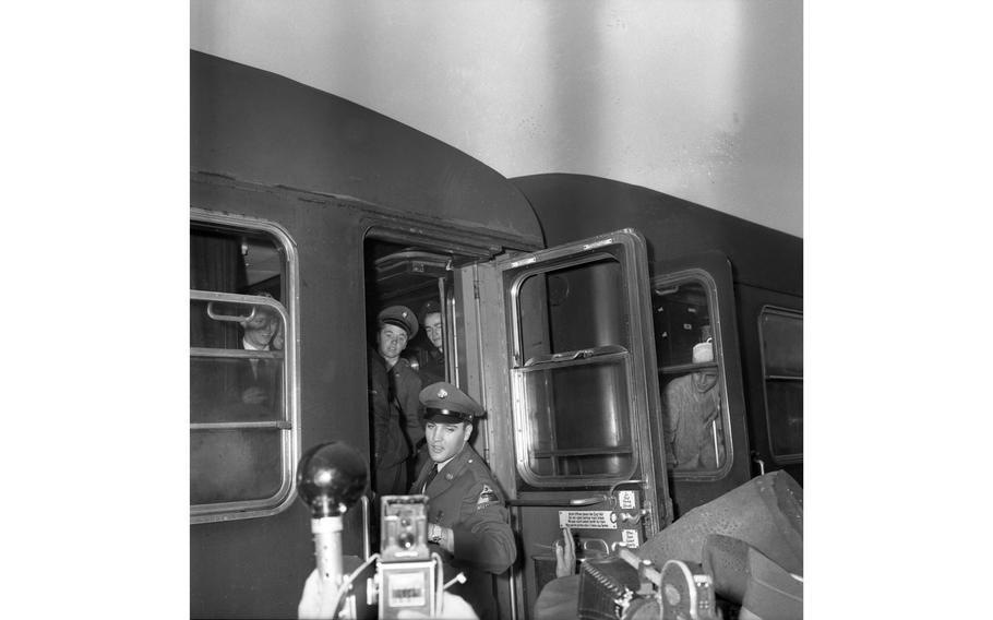 Pvt. Elvis Presley boards a troop train on his departure from Bremerhaven, Germany, to duty at Friedberg, near Frankfurt.