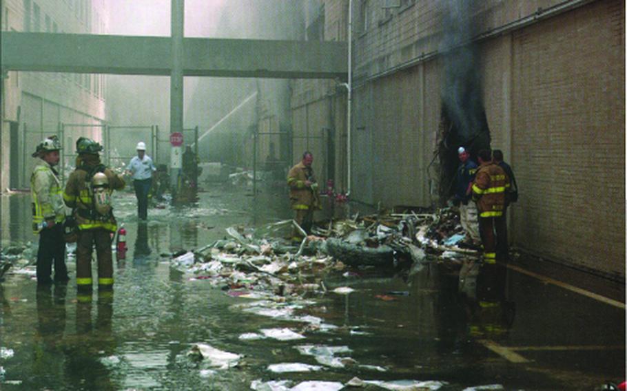 Retired Army Col. Marilyn Wills was working at the Pentagon on Sept. 11, 2001, when a highjacked airplane crashed into the building. She and others escaped by forcing out a second-floor window above the damaged wall shown here. 