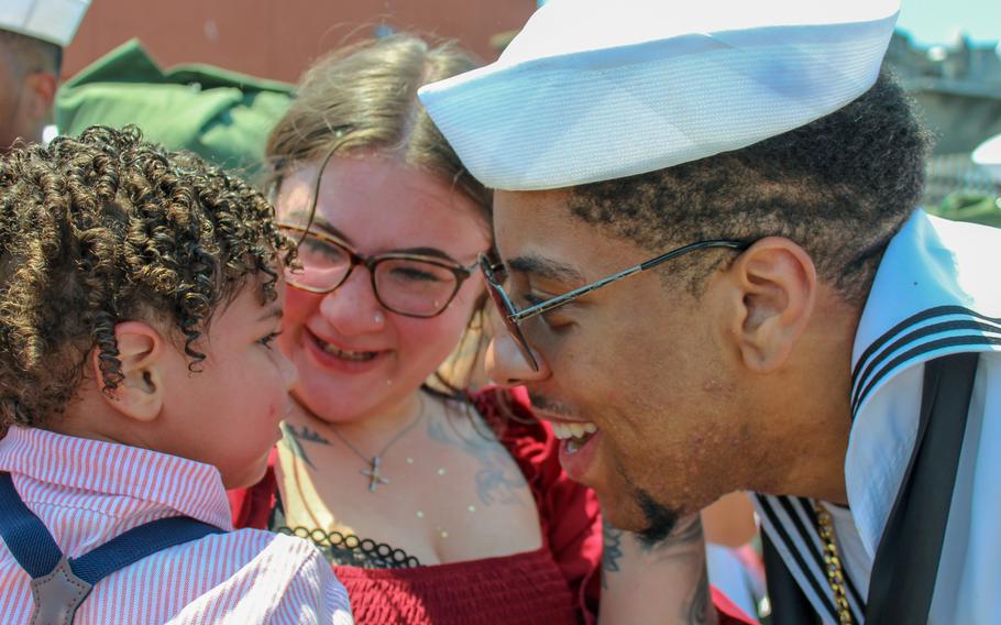 Aviation boatswain’s mate Kei-Ard Bell greets his wife Callie Bell and their 1-year-old son Malachi at Naval Station Norfolk, Va., on Sunday, July 14, 2024. The USS Dwight D. Eisenhower and about 5,000 sailors returned home from a deployment to the Red Sea. 