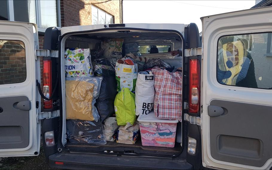 Donations collected by the U.S. military community in Belgium are loaded in a van before being transported to Ukraine on Feb. 27, 2022. A military spouses group in Belgium is collecting more donations and sending them to the Ukrainian Embassy in Brussels, an organizer said Monday.