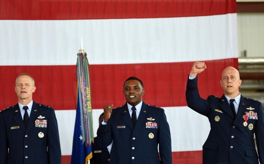 Three Air Force generals led airmen in the Air Force Song at the close of the 86th Airlift Wings change of command ceremony at Ramstein Air Base, Germany, on July 15, 2022. They are, from left to right, Maj. Gen. Derek C. France, 3rd Air Force commander; Brig. Gen. Otis C. Jones, the new 86th Airlift Wing commander; and Brig. Gen. Josh M. Olson, the outgoing wing commander, who is headed to the Pentagon.