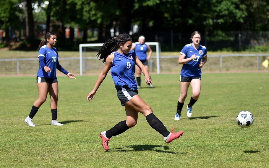 Brussels defender Arianna Harrison passes the ball while teammates Sonia Desir, left, and Taegan Muller follow along during the second day of round-robin action against Sigonella at the 2025 Division III DODEA European championships on May 20, 2025, at Rothenborn Stadion in Landstuhl, Germany.