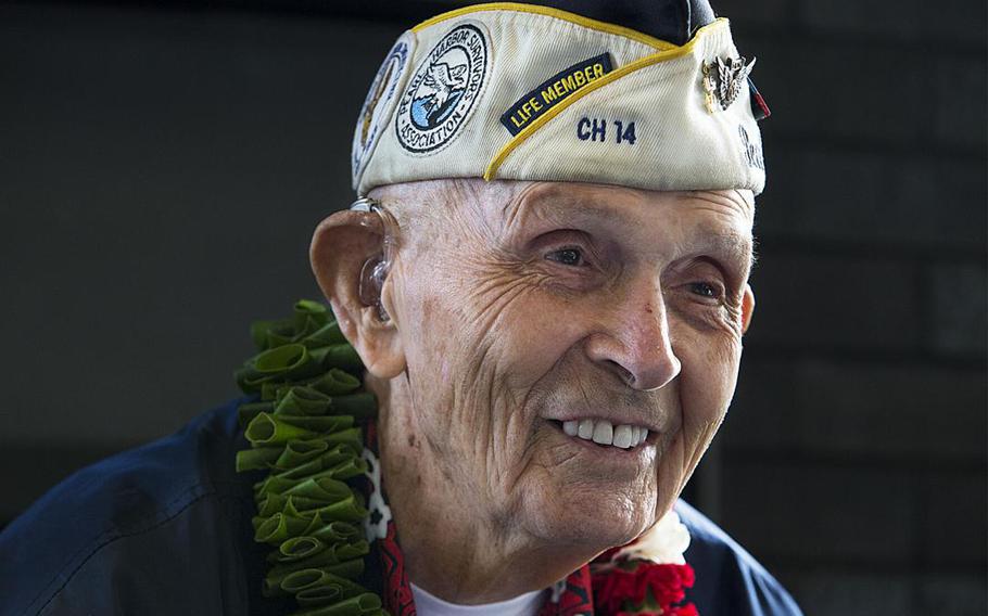 Dick Higgins smiles while talking with a visitor during his 100th birthday celebration in Bend on Saturday, July 24, 2021. Higgins served as a Navy radio operator in a PBY Catalina amphibious aircraft when Japan attacked Pearl Harbor on Dec. 7, 1941.