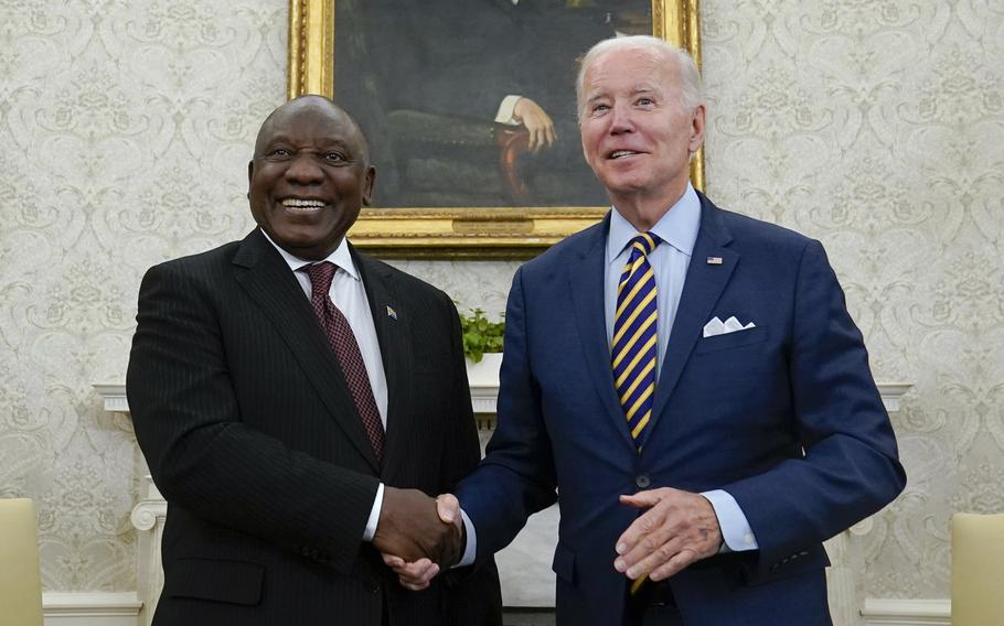 President Joe Biden shakes hands with South African President Cyril Ramaphosa as they meet in the Oval Office of the White House, Friday, Sept. 16, 2022, in Washington.