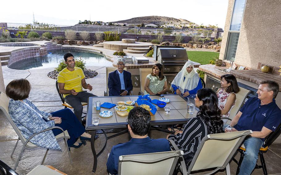 From left, Sen. Catherine Cortez Masto speaks with Mohammad “Benny” Shirzad, his father Abdul, wife Shabana and mother Nazanin along with Ellen and a Scott Hoffman and others on April 7, 2023, in Henderson, Nevada.