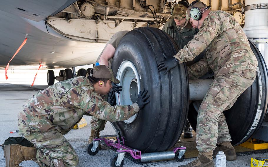 Airmen from the 436th Aircraft Maintenance Squadron work on a C-5M Super Galaxy in March 2020, at Dover Air Force Base, Del., wearing approved Operational Camouflage Pattern (OCP) bump caps. The Air Force on June 14, 2021, authorized airmen to wear camouflage tactical caps but said none are in stock at Army & Air Force Exchange Service outlets. 