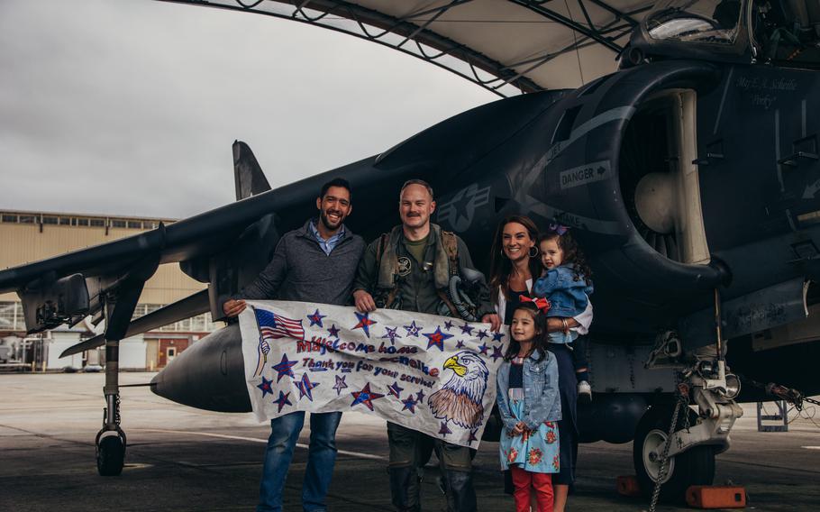 A U.S. Marine AV-8B pilot assigned to Marine Attack Squadron 231 Detachment, Marine Medium Tiltrotor Squadron 162 (Reinforced), 26th Marine Expeditionary Unit (Special Operations Capable) reunites with his family after returning from deployment at Marine Corps Air Station Cherry Point, N.C., Saturday, March 16, 2024.