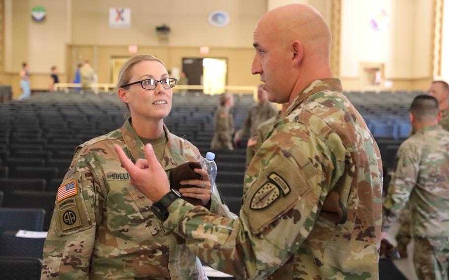 Then-Lt. Col. Meghann Sullivan talks with Command Sgt. Maj. Scott Brinson of the 2nd Battalion, 5th Security Force Assistance Brigade during her change of command ceremony on June 28, 2021, at Joint Base Lewis-McChord, Wash.  Sullivan became the first woman to command an SFAB battalion as she took the helm of the 5th Battalion of the 5th SFAB.