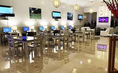 The new USO Tumon Bay on Guam features a lounge and gaming room with several big-screen televisions. Reading areas and stress relieving massage chairs add to a relaxed setting, and a conference room is set aside for private meetings.