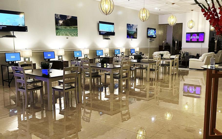 The new USO Tumon Bay on Guam features a lounge and gaming room with several big-screen televisions. Reading areas and stress relieving massage chairs add to a relaxed setting, and a conference room is set aside for private meetings.