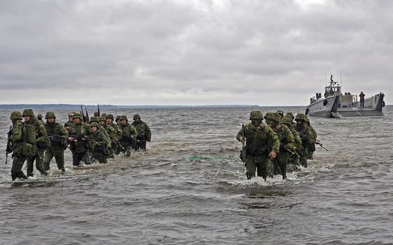 Estonian troops move ashore during amphibious assault training. MUST CREDIT: Sgt. Rocco DeFilippis/U.S. Navy.