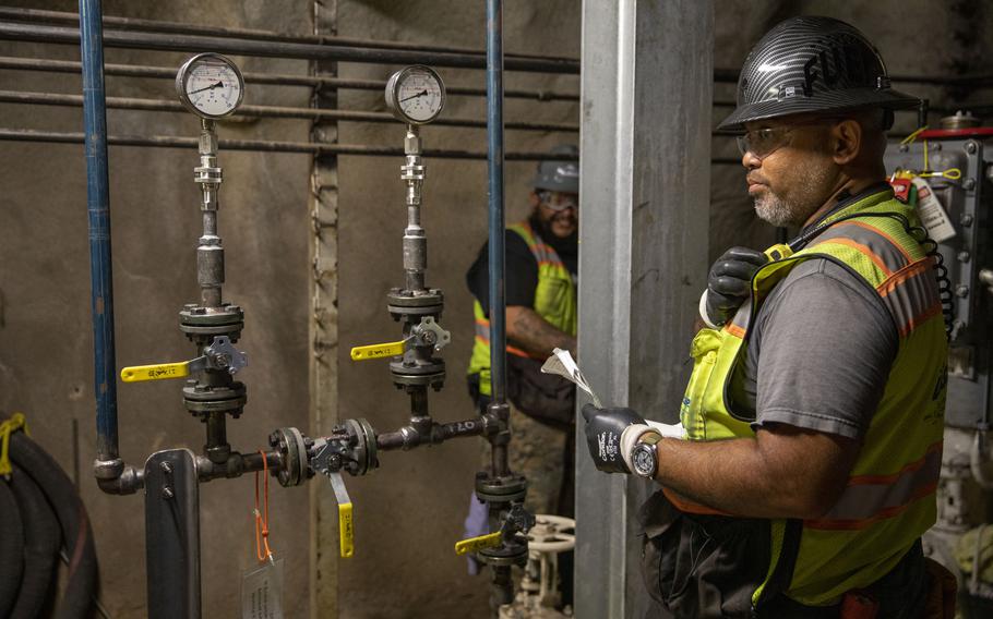 A leader with Joint Task Force Red Hill facilitates dewatering operations at the Red Hill Bulk Fuel Storage Facility in Halawa, Hawaii, April 17, 2022.