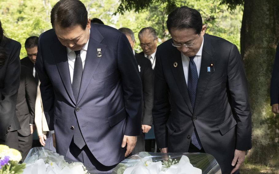 South Korea’s President Yoon Suk Yeol, left, and Japan’s Prime Minister Fumio Kishida bow as they lay flowers at the Monument in Memory of the Korean Victims of the A-bomb near the Peace Park Memorial in Hiroshima, western Japan Sunday, May 21, 2023, on the sidelines of the G7 Summit Leaders’ Meeting. 