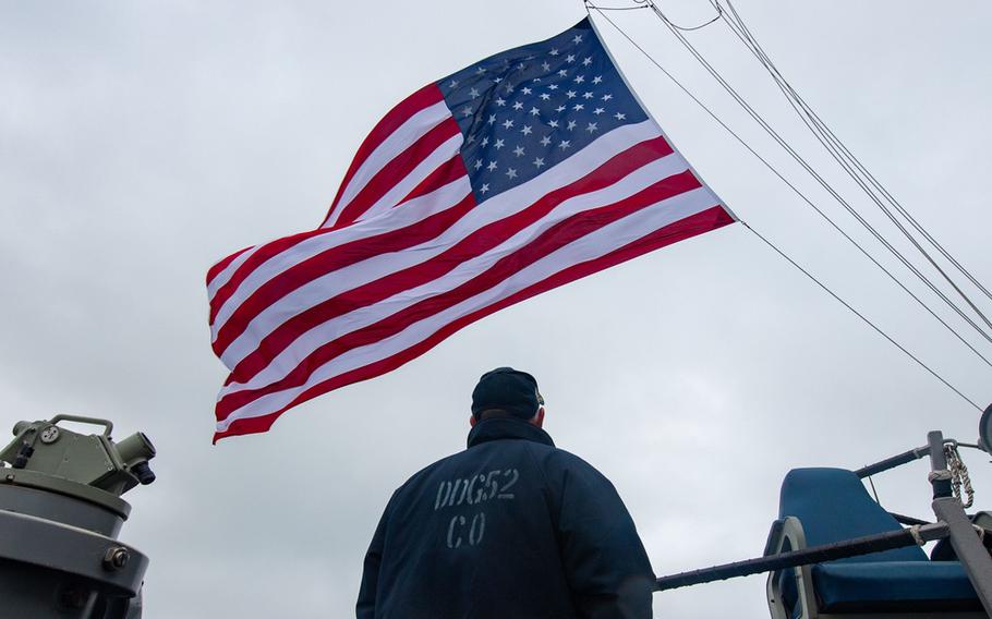 Cmdr. Chris Gahl stands aboard the USS Barry as the guided-missile destroyer passes through the Taiwan Strait late last year.