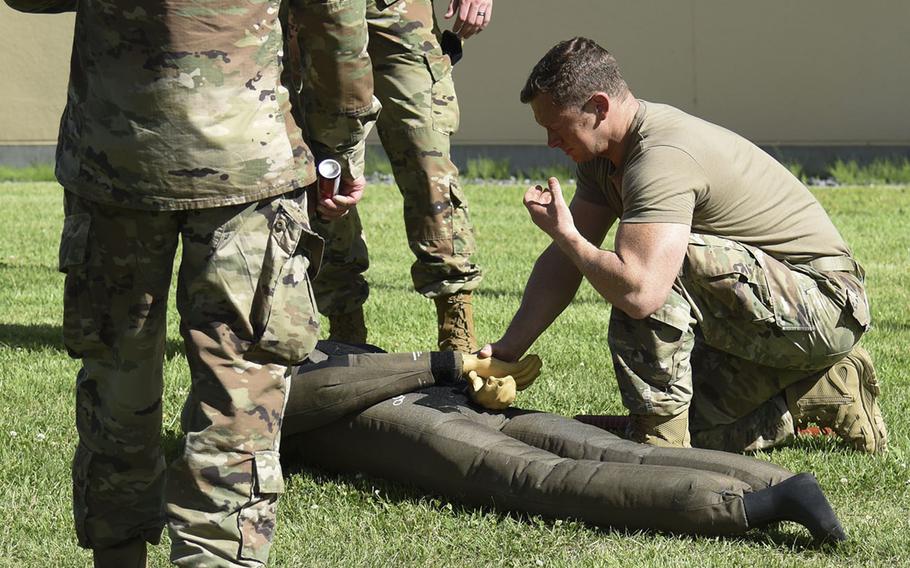 Maj. Matthew Stillman, commander of the 374th Security Forces Squadron, practices making an arrest after being pepper-sprayed during training at Yokota Air Base, Japan, July 21, 2021.  