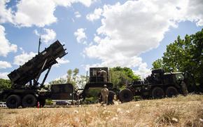 U.S. Army Spc. Rem Mendoza, top, Cpl. Christian Grantham, center, and Staff Sgt. Aaron Agsaoay, right, inspect a Patriot air-defense battery at Clark Air Base, Philippines, May 2, 2024.