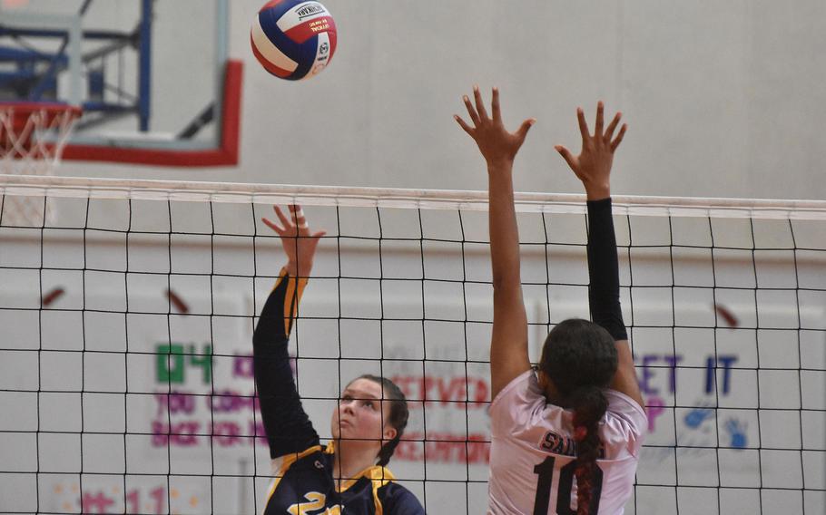 Ansbach freshman Kennedy Lange uses a soft touch to get by the block of Aviano's Sophia Fisher on Saturday, Oct. 15, 2022.
