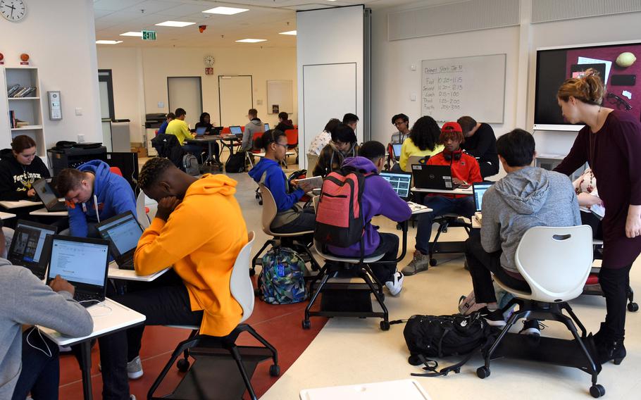 Students do classwork at Kaiserslautern High School in Germany in 2019. A new program at DODEA schools worldwide that provides online access to student grades, attendance, assignments and other information has been delayed by technical issues. 